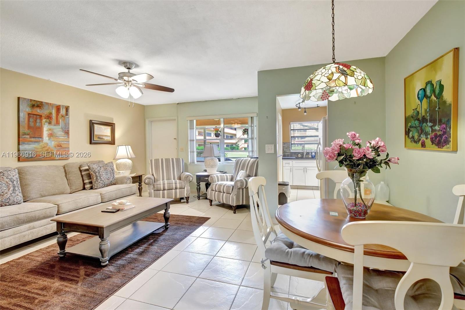 5300 Washington Street, Unit G127 Hollywood, FL 33021 - Photo 7 of 39 a living room with furniture chandelier and a chandelier