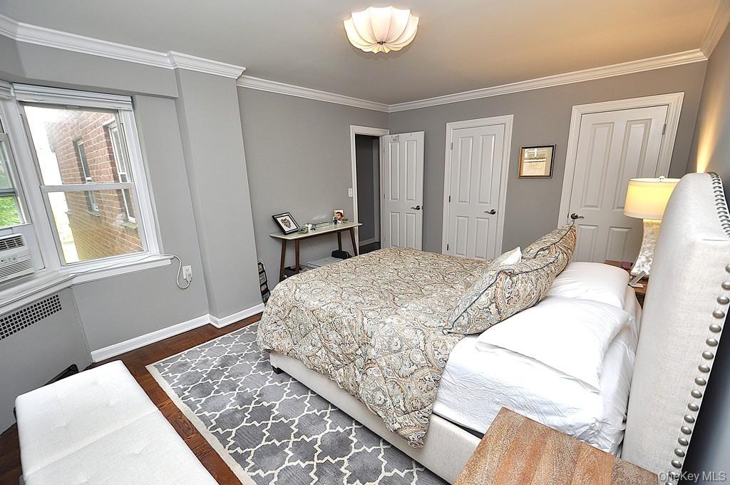 235 Garth Road, Unit E2E Scarsdale, NY 10583 - Photo 20 of 46 The large bedroom has two closets, a bay window and refinished parquet floors. The bedroom is approx. 15'-4" x 11'-9".