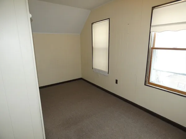 a view of a room that has a window in it