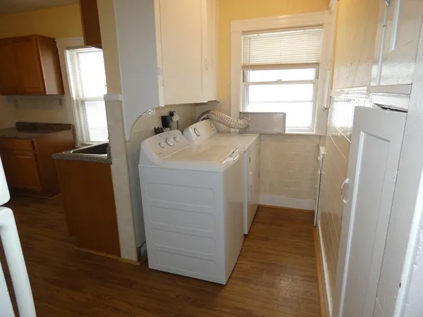 a bathroom with a sink a mirror and a window