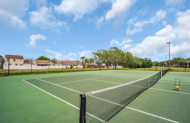 a view of an outdoor space and tennis court