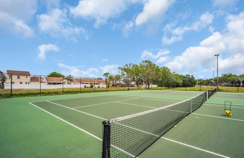 10110 Winsford Oak Boulevard, Unit 621 Tampa, FL 33624 - Photo 7 of 7 a view of an outdoor space and tennis court