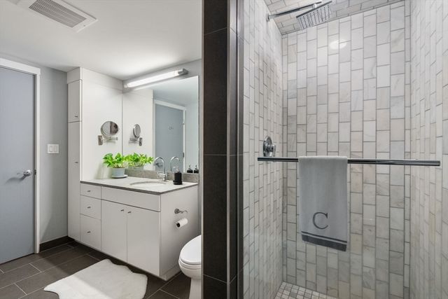 a bathroom with a bathtub and shower