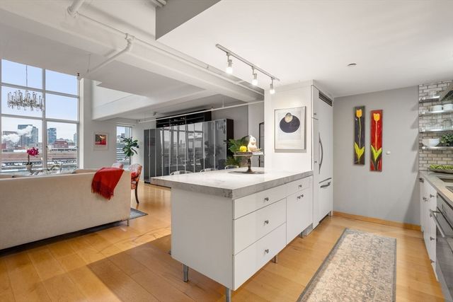 a living room filled with furniture and a large window