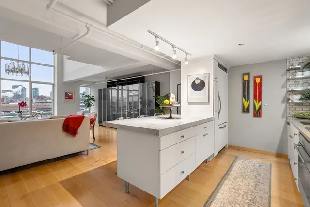 a living room filled with furniture and a large window