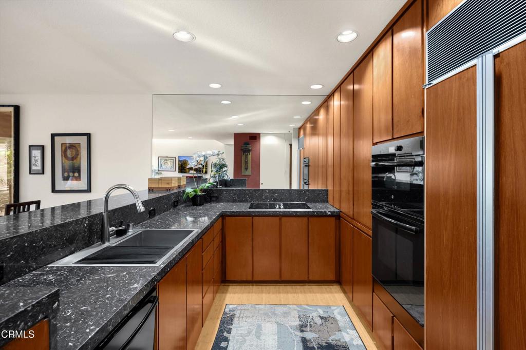 200 Arroyo Terrace Pasadena, CA 91103 - Photo 18 of 66 a kitchen with stainless steel appliances granite countertop a stove a sink and a refrigerator