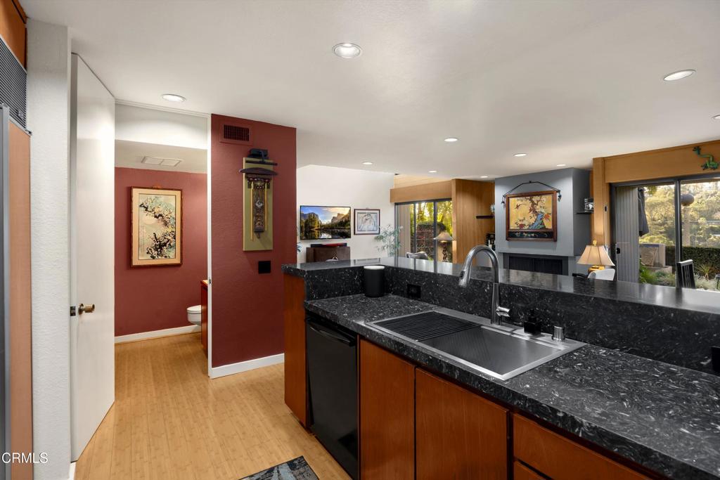 200 Arroyo Terrace Pasadena, CA 91103 - Photo 19 of 66 a kitchen with granite countertop a sink and cabinets