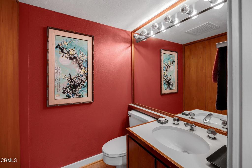 200 Arroyo Terrace Pasadena, CA 91103 - Photo 20 of 66 a bathroom with a sink mirror vanity and toilet
