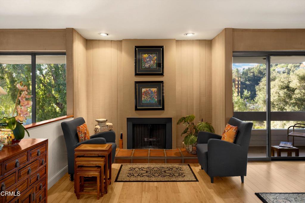 200 Arroyo Terrace Pasadena, CA 91103 - Photo 22 of 66 a living room with furniture fireplace and large window