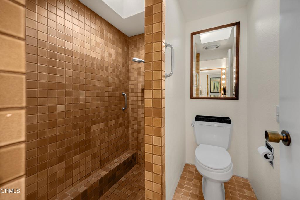 200 Arroyo Terrace Pasadena, CA 91103 - Photo 29 of 66 a bathroom with a toilet and shower