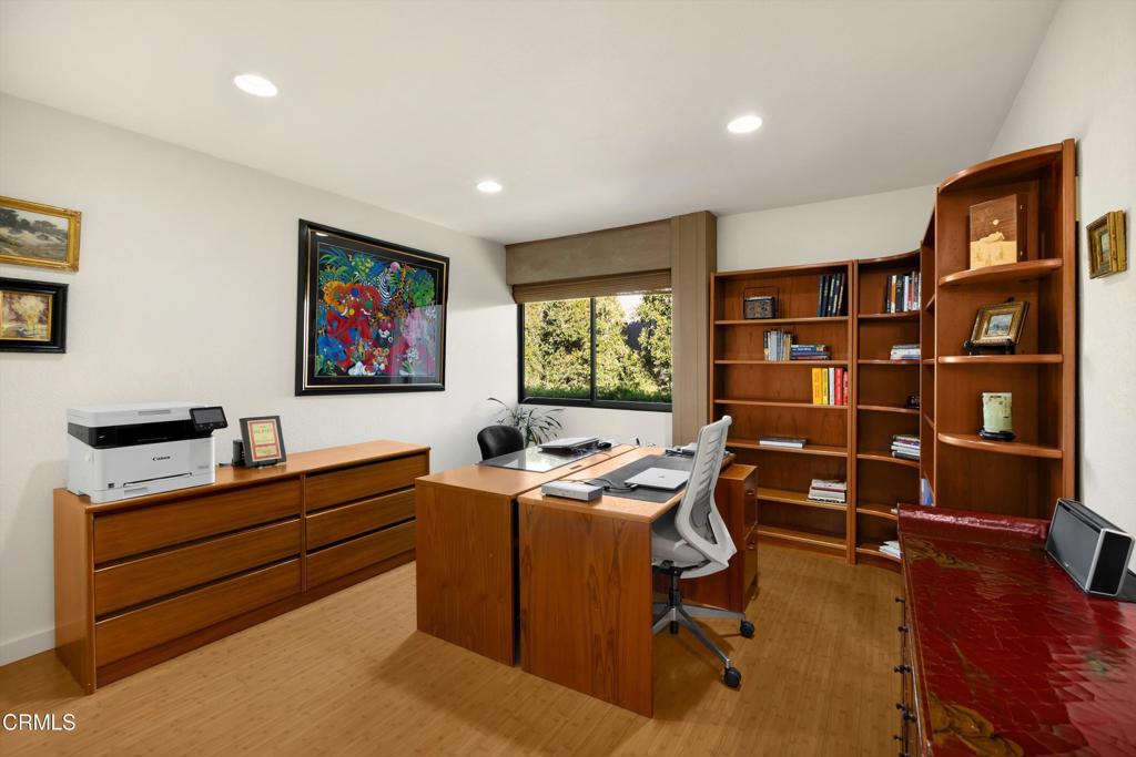 200 Arroyo Terrace Pasadena, CA 91103 - Photo 31 of 66 a room with furniture a bookshelf and a window