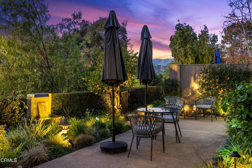 200 Arroyo Terrace Pasadena, CA 91103 - Photo 54 of 66 a view of a backyard with table and chairs with wooden fence