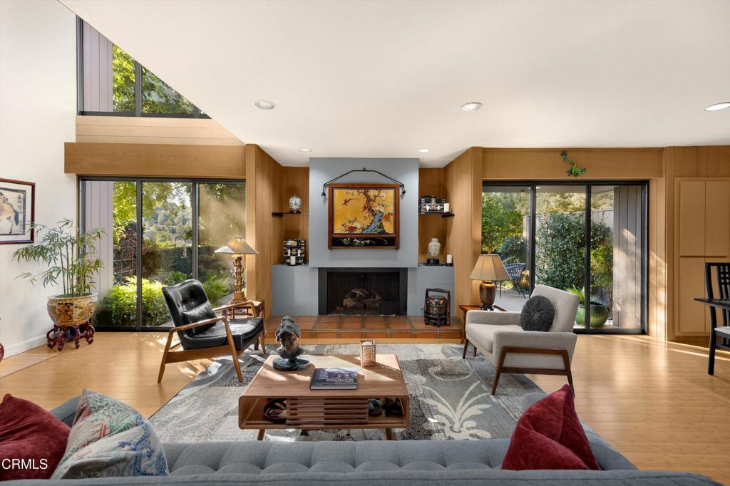 200 Arroyo Terrace Pasadena, CA 91103 - Photo 7 of 66 a living room with furniture large window and a fireplace