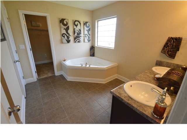 5617 Price Plantation Road Baker, FL 32531 - Photo 11 of 13 a bathroom with a sink and a mirror