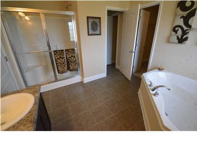 5617 Price Plantation Road Baker, FL 32531 - Photo 12 of 13 a bathroom with a sink toilet and shower