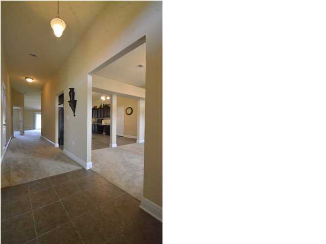 5617 Price Plantation Road Baker, FL 32531 - Photo 3 of 13 a view of a bathroom with a sink and a mirror