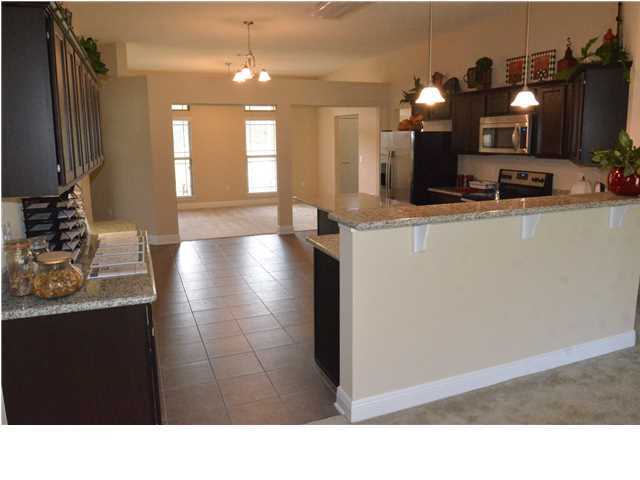 5617 Price Plantation Road Baker, FL 32531 - Photo 8 of 13 a bathroom with a sink and a mirror
