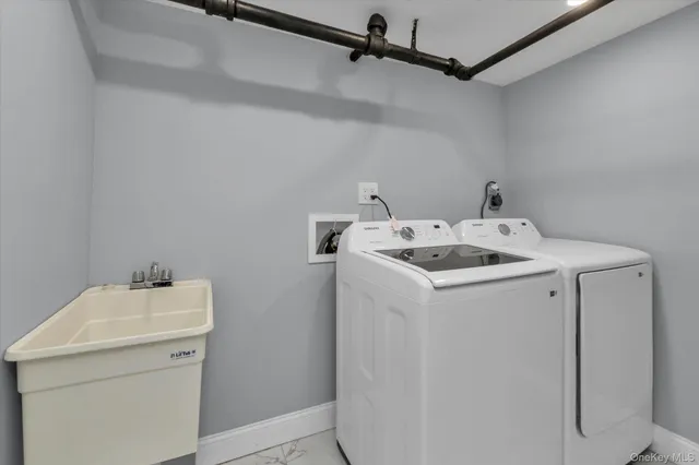 a utility room with dryer and washer
