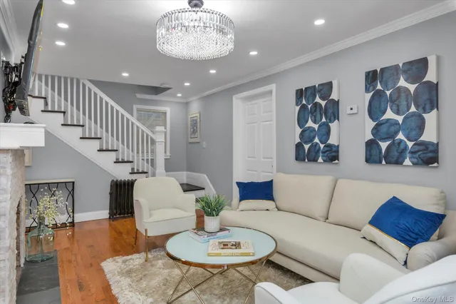 a living room with furniture and a dining table