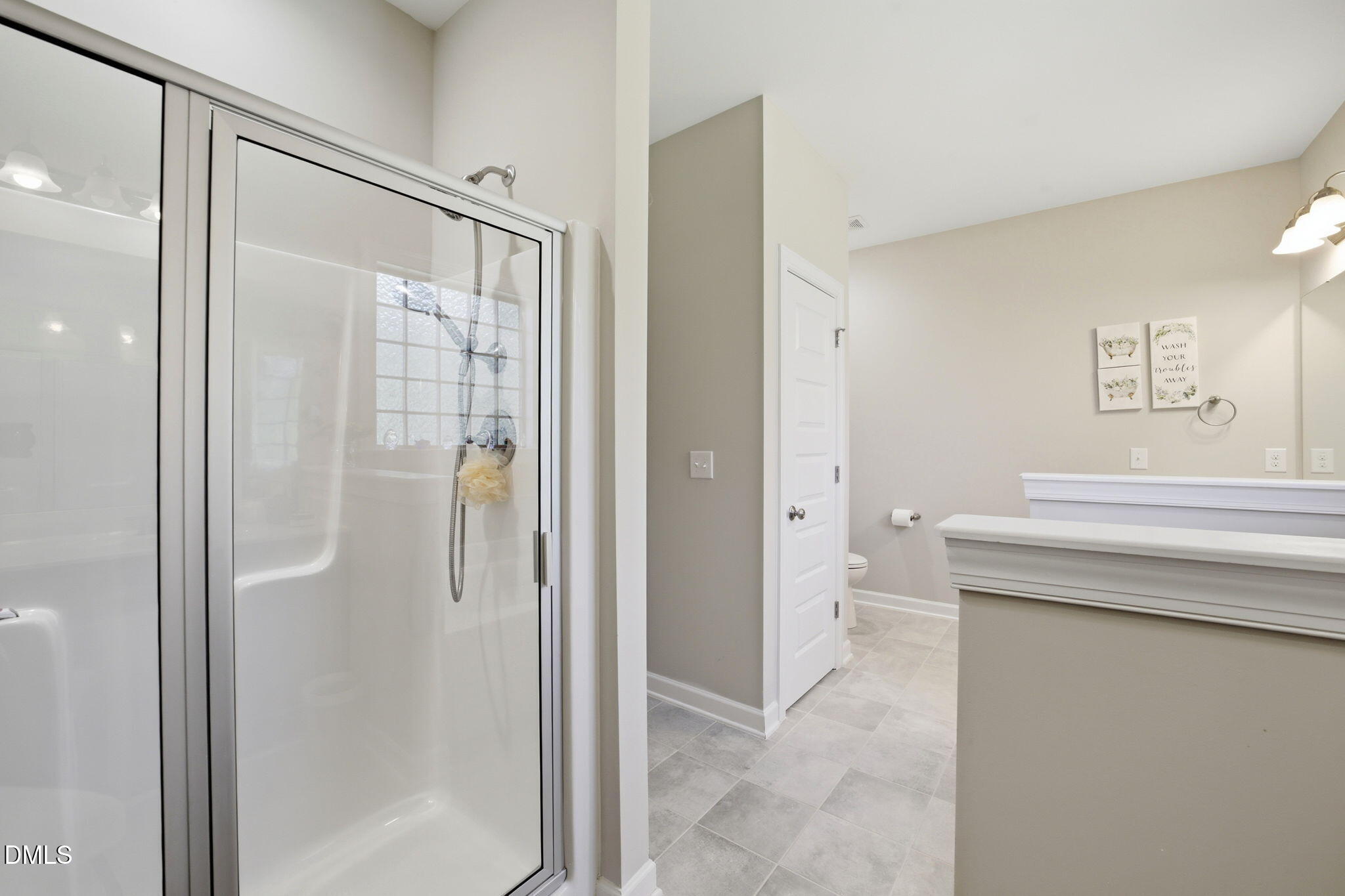 1547 Lassiter Pond Road Four Oaks, NC 27524 - Photo 23 of 45 a bathroom with a shower and a sink