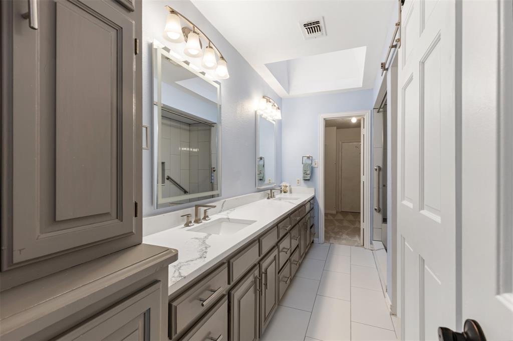609 Seville Road Denton, TX 76205 - Photo 30 of 40 Second Primary en-suite Bathroom, recently updated, with walk-in closet and attic access.