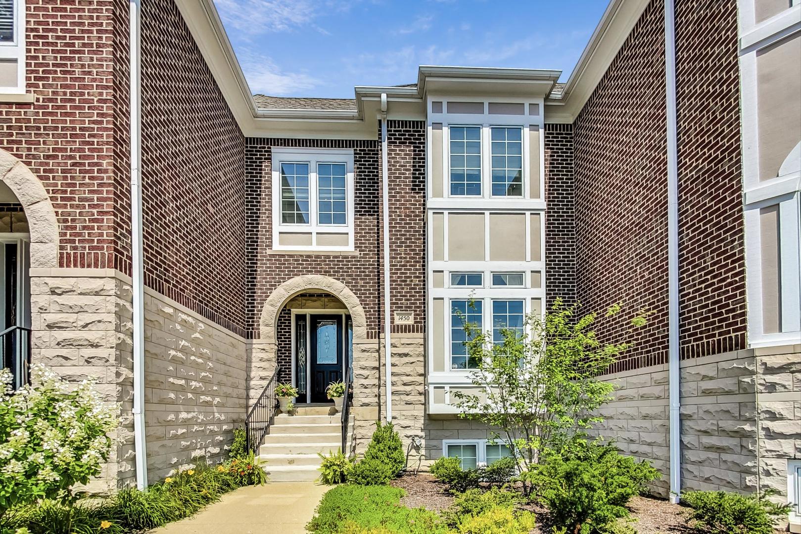 1450 East Northwest Highway, Unit 13 Arlington Heights, IL 60004 - Photo 1 of 33 a front view of a house