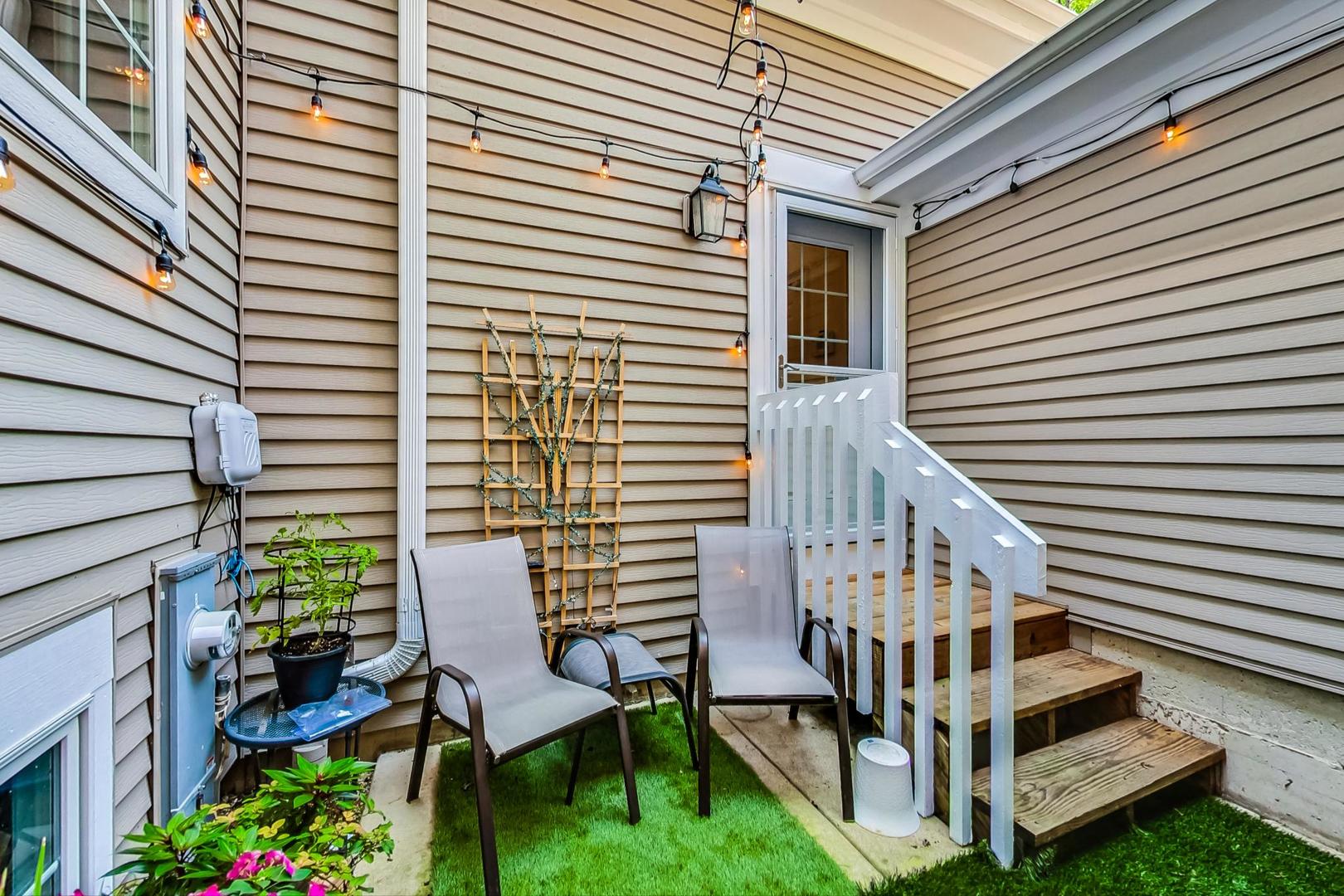 1450 East Northwest Highway, Unit 13 Arlington Heights, IL 60004 - Photo 28 of 33 a view of a chairs with a roof deck