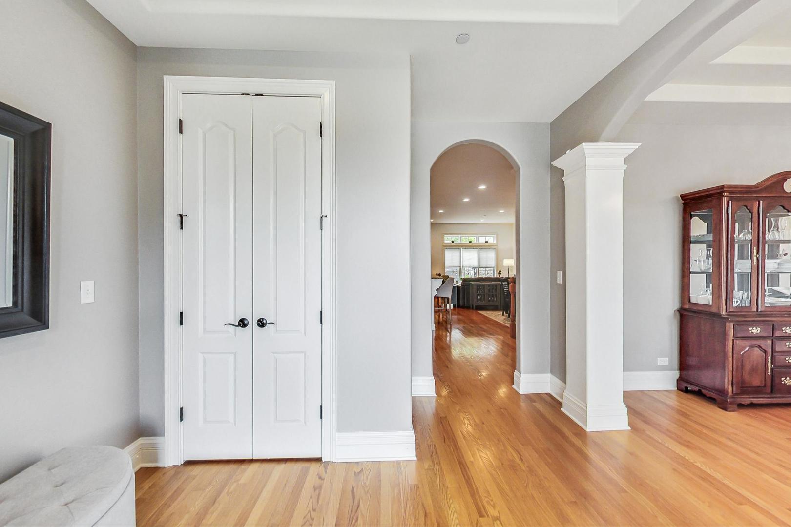 1450 East Northwest Highway, Unit 13 Arlington Heights, IL 60004 - Photo 3 of 33 a view of a room with wooden floor and furniture
