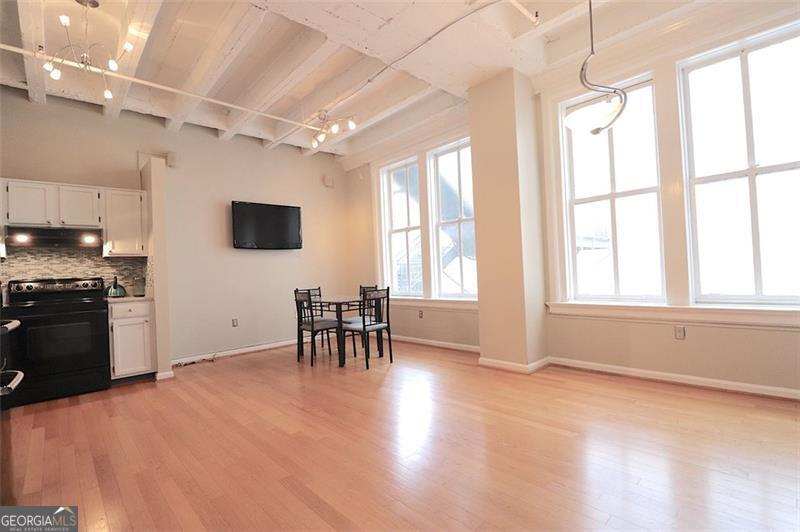 32 Peachtree Street, Unit 1601 Atlanta, GA 30303 - Photo 11 of 55 a view of a kitchen with furniture and a stove