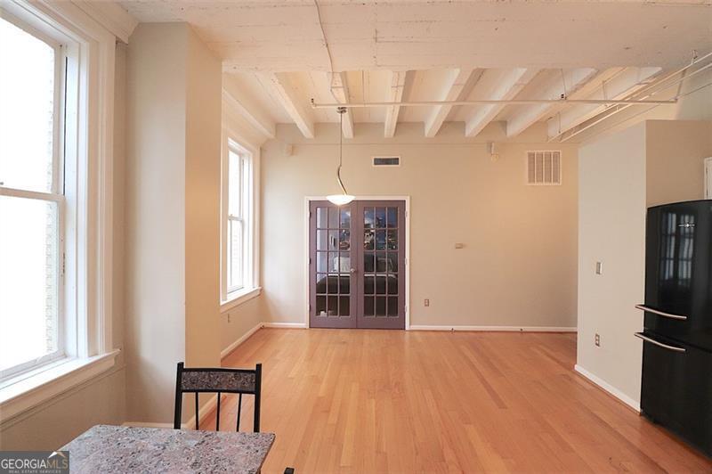 32 Peachtree Street, Unit 1601 Atlanta, GA 30303 - Photo 15 of 55 a view of empty room with wooden floor and fan