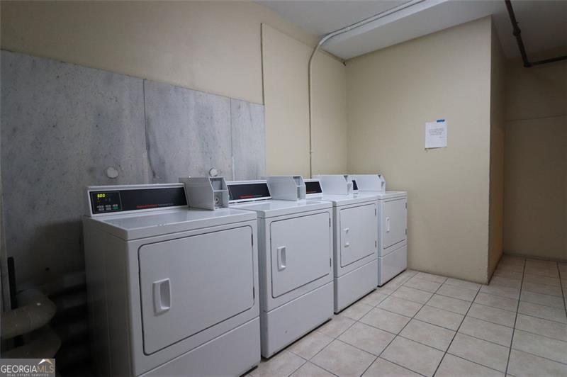 32 Peachtree Street, Unit 1601 Atlanta, GA 30303 - Photo 38 of 55 a utility room with dryer and washer