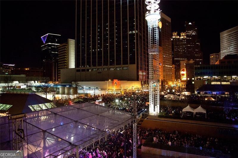 32 Peachtree Street, Unit 1601 Atlanta, GA 30303 - Photo 55 of 55 a city street filled with lots of traffic and parked cars