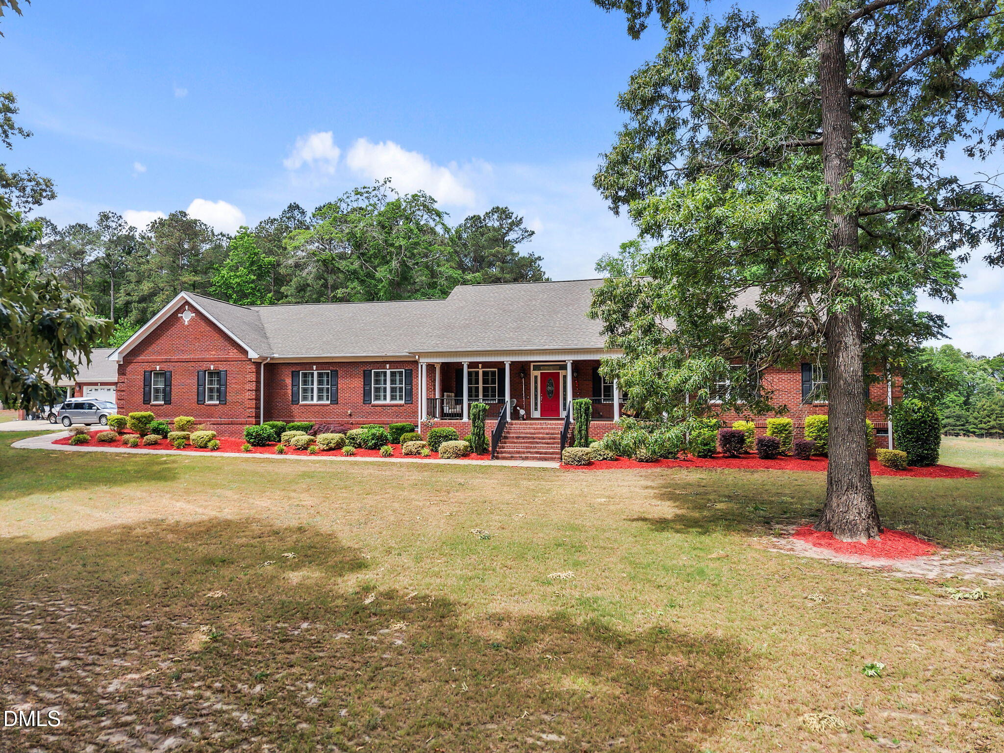 2880 Elevation Road Four Oaks, NC 27524 - Photo 6 of 51 a front view of house with yard and green space