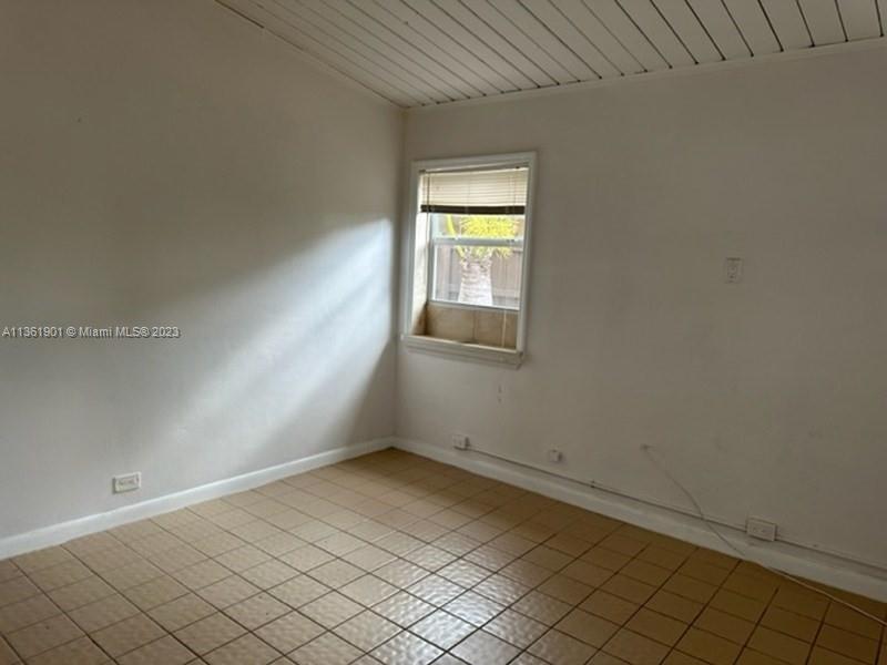 363 Glouchester Street Boca Raton, FL 33487 - Photo 6 of 13 an empty room with windows