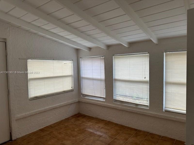363 Glouchester Street Boca Raton, FL 33487 - Photo 7 of 13 an empty room with a window