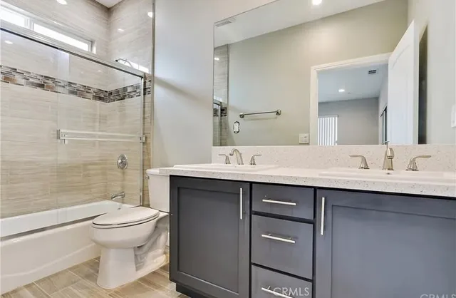 an empty room with windows and entrance