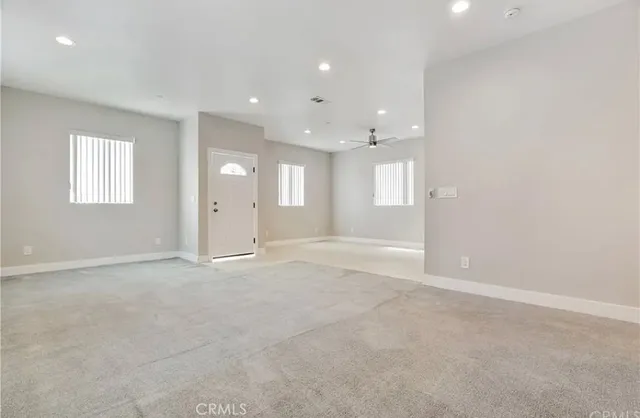 a bathroom with a double vanity sink toilet and shower