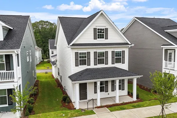 a aerial view of a house with swimming pool and porch