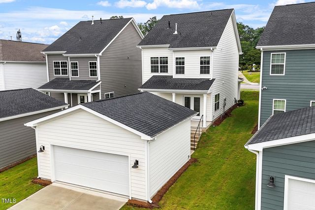 a front view of a house with yard