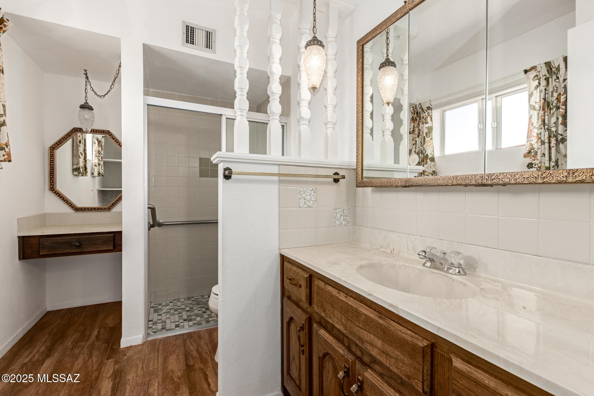 16381 South Observatory Place Vail, AZ 85641 - Photo 12 of 23 a bathroom with a sink and mirror