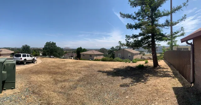 a view of a street with a parked car