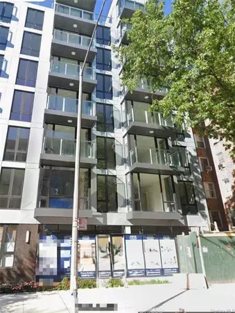 a view of houses with a street