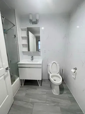 a bathroom with a sink toilet and vanity