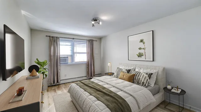 a bedroom with bed and a couch