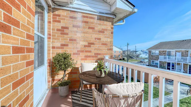 a view of a balcony with chairs