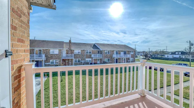a view of a large building from a balcony