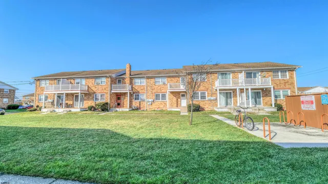 a view of a big room with a big yard and large trees