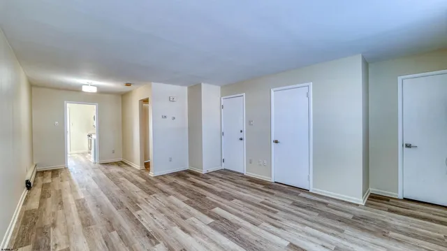 a view of a livingroom with wooden floor