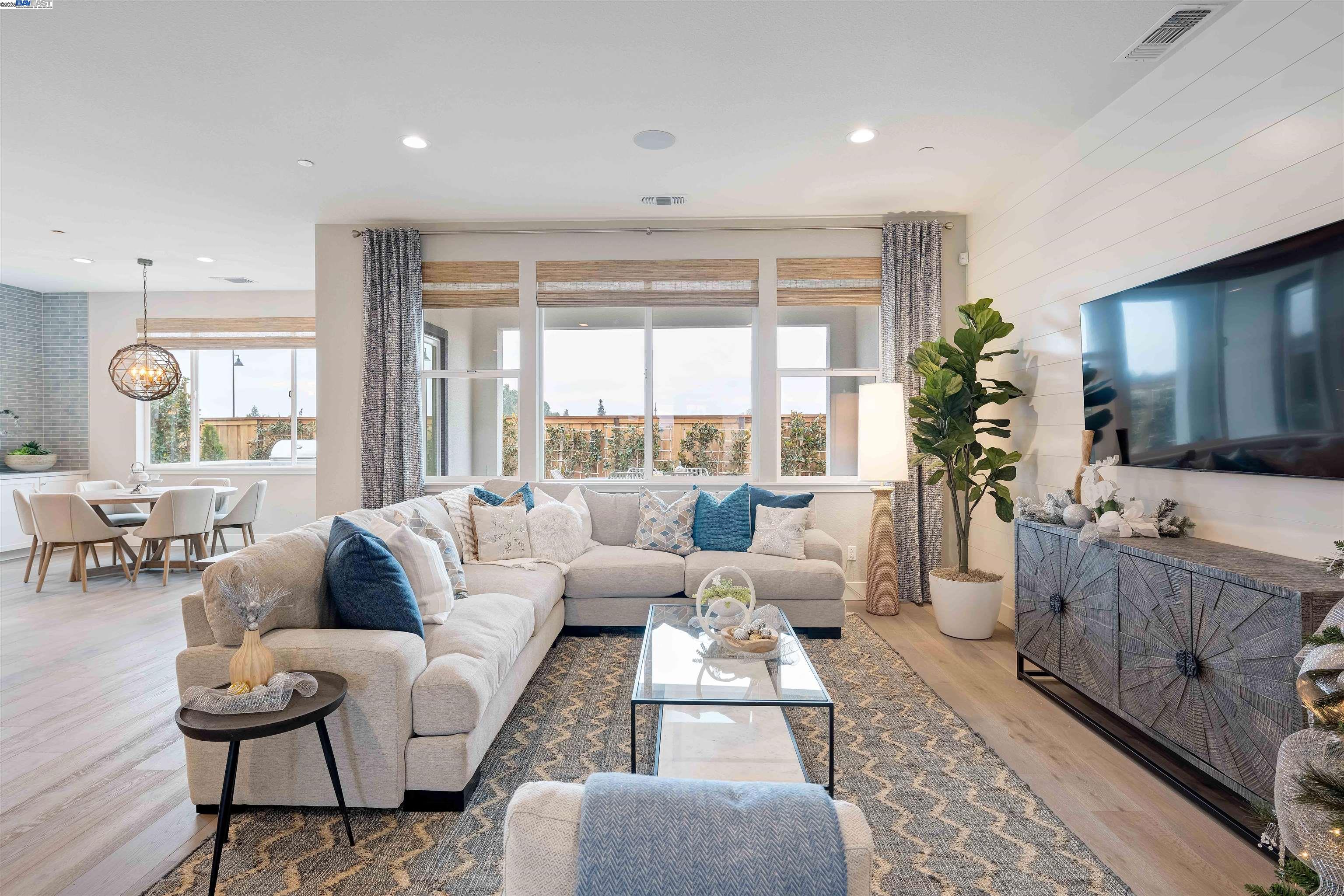 1371 Crescent Avenue Manteca, CA 95336 - Photo 13 of 55 a living room with furniture large window and flat screen tv