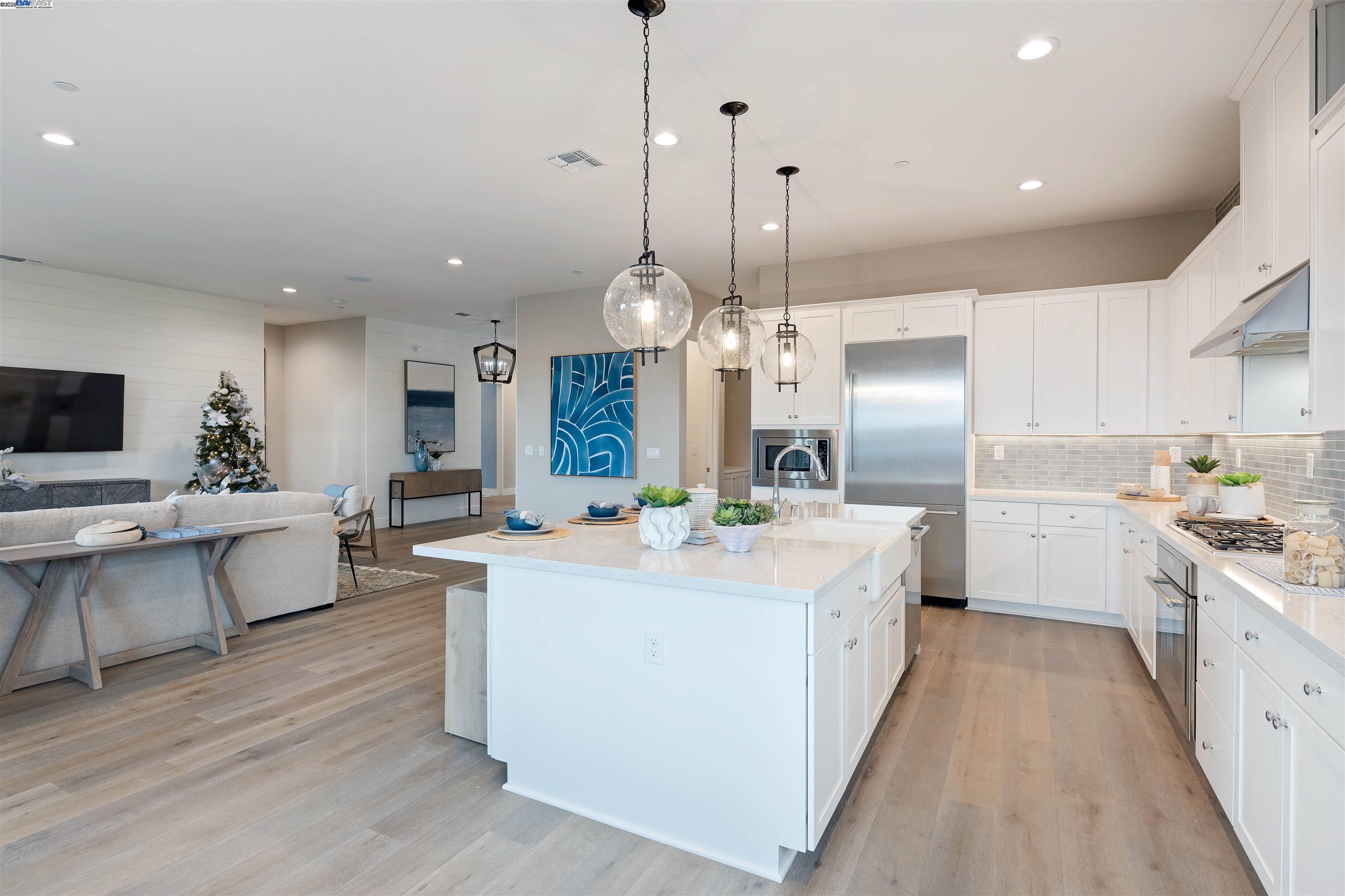 1371 Crescent Avenue Manteca, CA 95336 - Photo 15 of 55 a large kitchen with kitchen island a large island in it